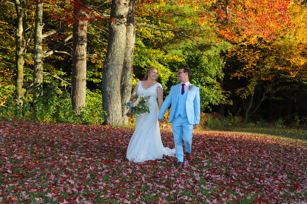 Bride and groom walking in leaves - White Mountains Photo Pro